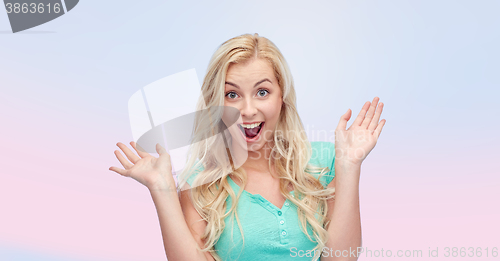 Image of surprised smiling young woman or teenage girl