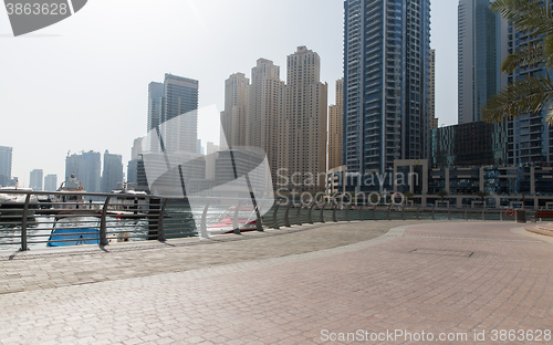 Image of Dubai city seafront or harbor with boats