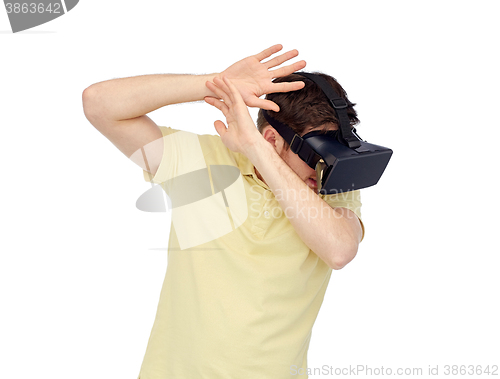 Image of happy man in virtual reality headset or 3d glasses