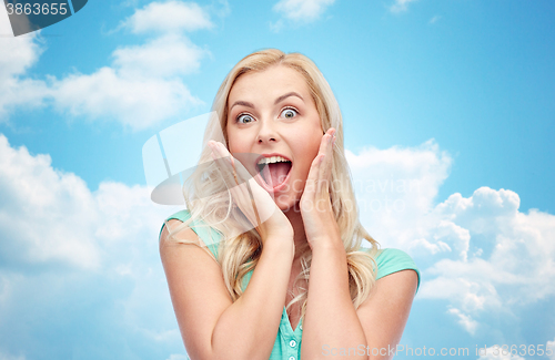 Image of surprised smiling young woman or teenage girl