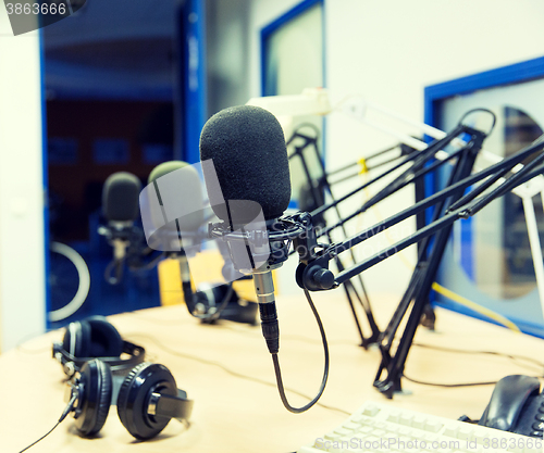 Image of microphone at recording studio or radio station