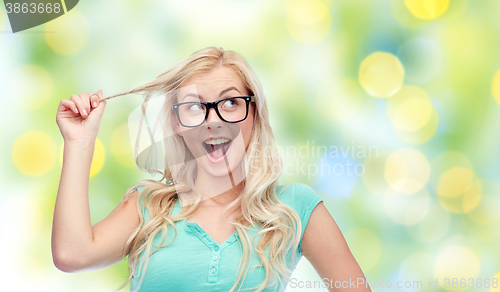 Image of happy young woman or teenage girl in glasses
