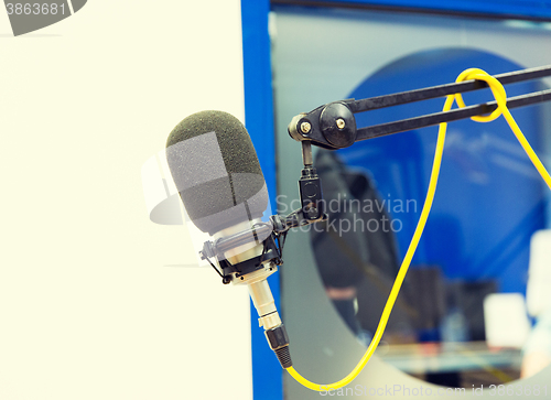 Image of microphone at recording studio or radio station