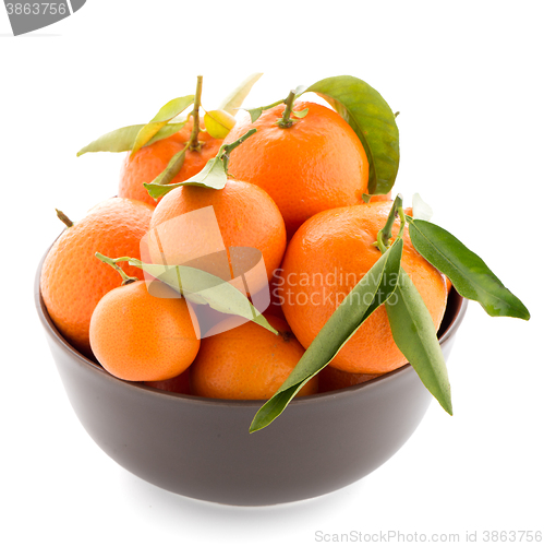 Image of Tangerines on ceramic brown  bowl 