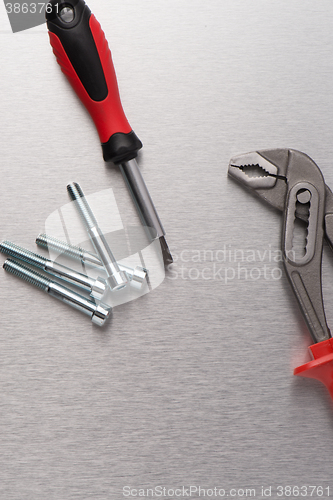 Image of Spanner tool and screws