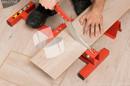 Image of Red tool for cutting laminate