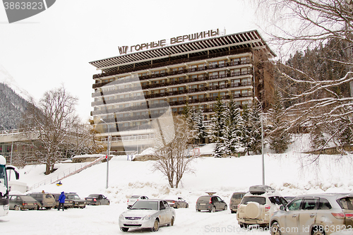 Image of Dombay, Russia - 7 February 2015: Hotel \"Mountain peaks\" located in the small town of Dombay Street. Karachai, 117