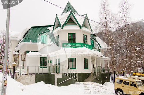 Image of Dombay, Russia - 7 February 2015: The building of additional office ?8585 / 016 Sberbank of Russia, located in the small town of Dombay