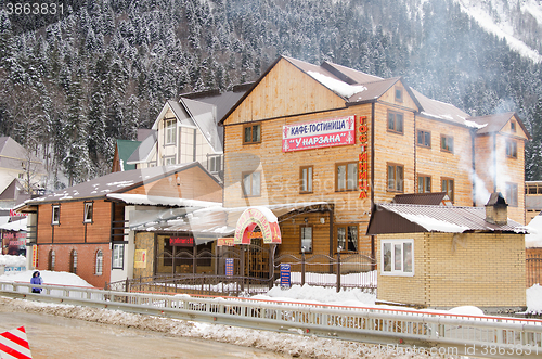 Image of Dombay, Russia - 7 February 2015: Cafe-hotel \"At Narzan\" is located in the small town of Dombay