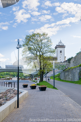 Image of Narva River embankment with vacationers people and the border of Russia and the European Union