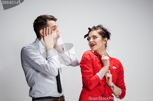 Image of The business man and woman communicating on a gray background