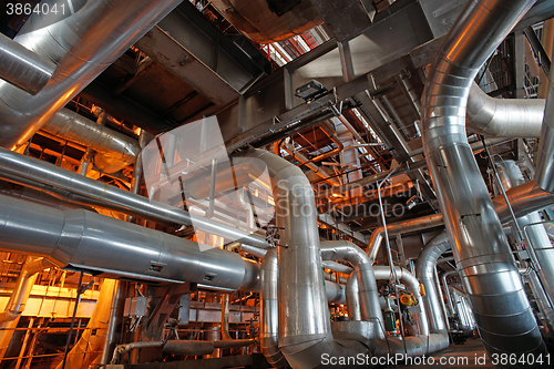 Image of Equipment, cables and piping as found inside of a modern industr