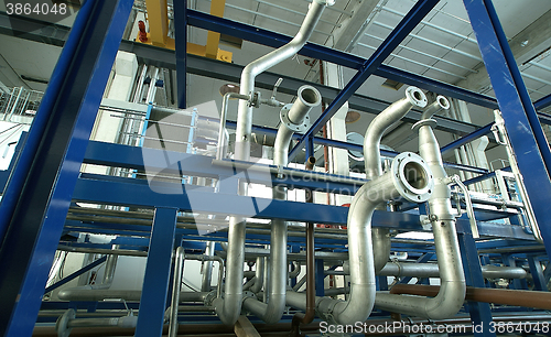 Image of Equipment, cables and piping as found inside of a modern industr