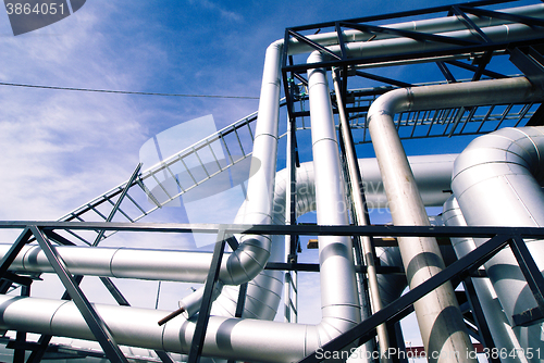 Image of Industrial zone, Steel pipelines in blue tones  