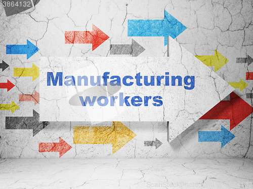 Image of Manufacuring concept: arrow with Manufacturing Workers on grunge wall background