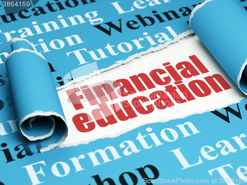 Image of Education concept: red text Financial Education under the piece of  torn paper