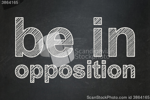 Image of Political concept: Be in Opposition on chalkboard background