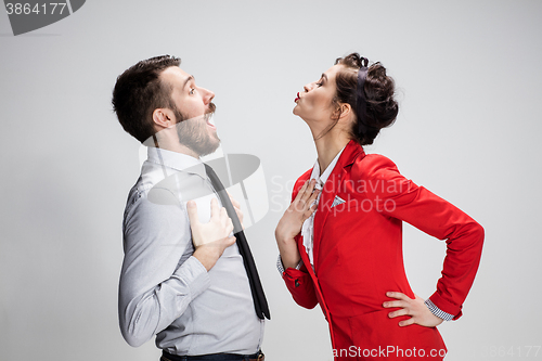 Image of The business man and woman communicating on a gray background