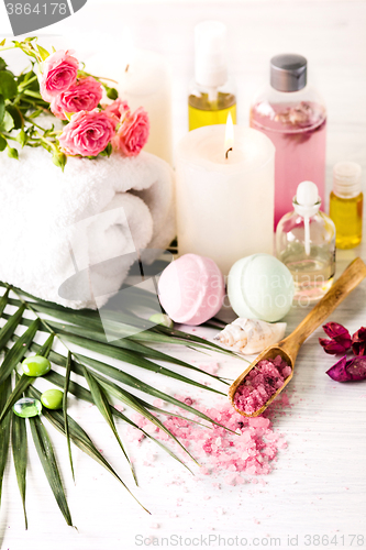 Image of Spa setting with pink roses and aroma oil, vintage style 