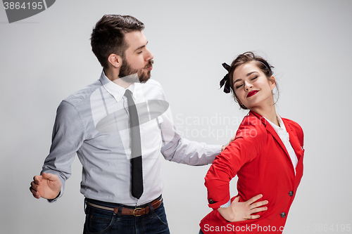 Image of The business man and woman communicating on a gray background