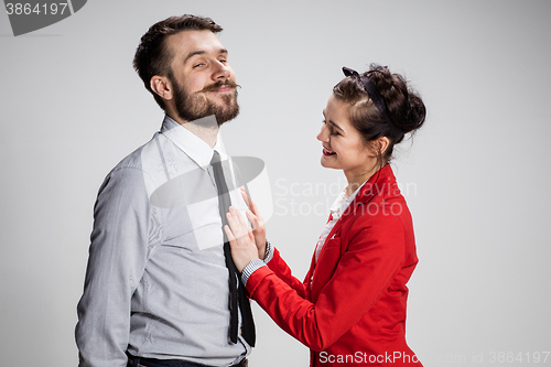 Image of The business man and woman communicating on a gray background