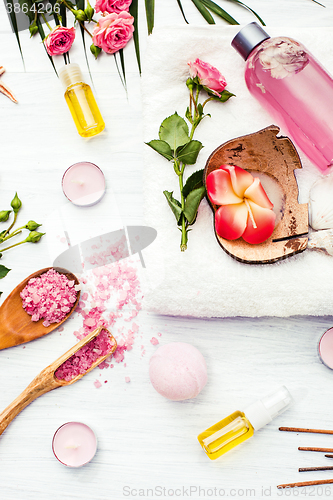 Image of Spa setting with pink roses and aroma oil, vintage style 