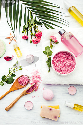 Image of Spa setting with pink roses and aroma oil, vintage style 