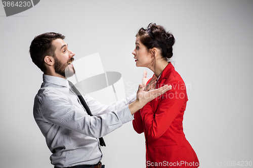 Image of The business man and woman communicating on a gray background