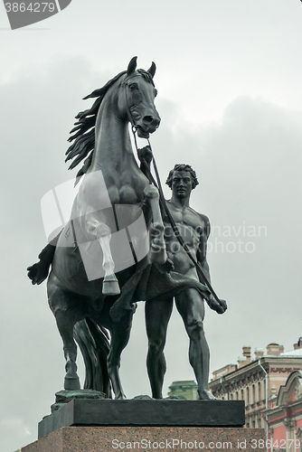 Image of Sculpture horseman with a horse.