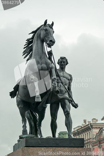 Image of Sculpture horseman with a horse.