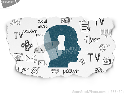 Image of Advertising concept: Head With Keyhole on Torn Paper background