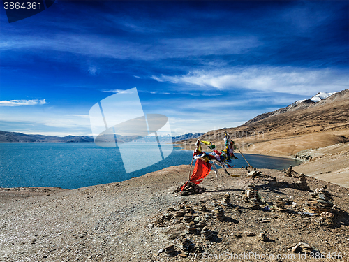 Image of Buddhist prayer flags lungta at Himalayan lake