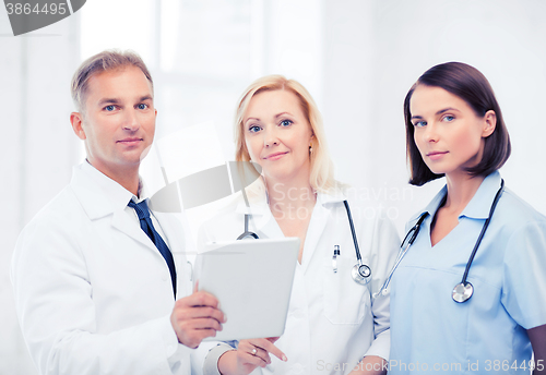 Image of doctors looking at tablet pc