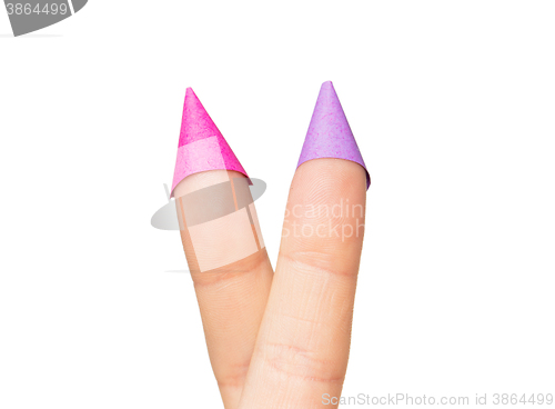 Image of close up of two fingers in party hats