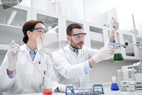 Image of young scientists making test or research in lab