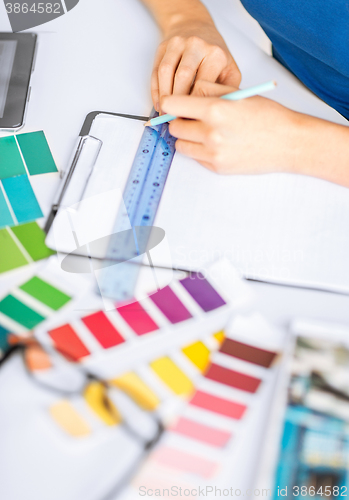 Image of woman working with color samples for selection