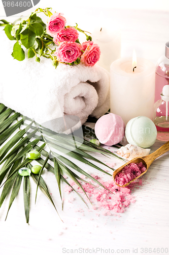 Image of Spa setting with pink roses and aroma oil, vintage style 