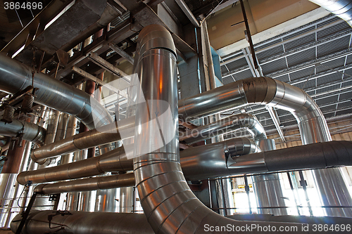 Image of Equipment, cables and piping as found inside of a modern industr