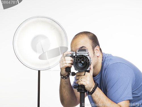 Image of professional photographer with photographic equipment