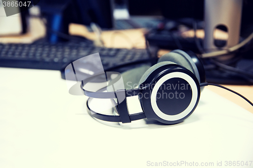 Image of headphones at recording studio or radio station