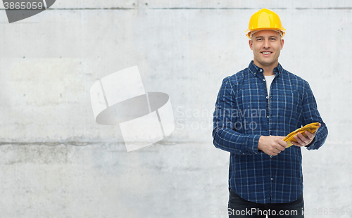 Image of smiling man in helmet with gloves