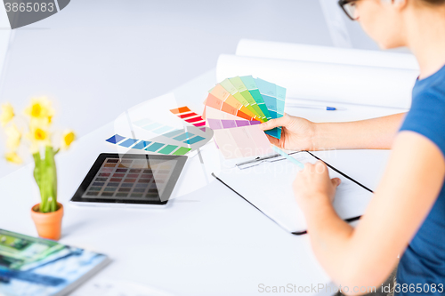 Image of woman working with color samples for selection