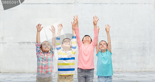 Image of happy children celebrating victory on street