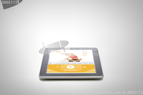 Image of tablet pc with fitness application on screen