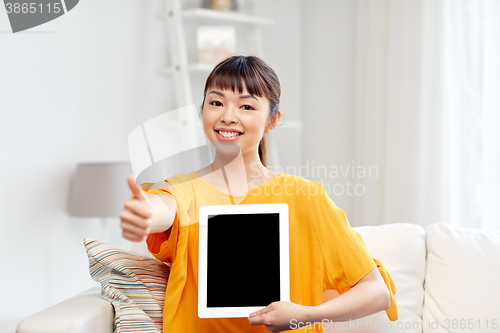 Image of happy asian woman with tablet pc and thumbs up