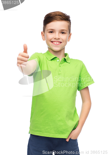 Image of happy boy in green polo t-shirt showing thumbs up