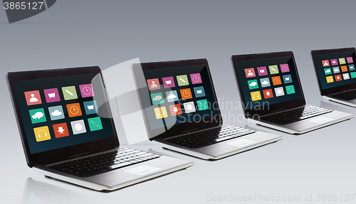 Image of laptop with application icons menu on screen