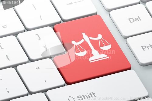 Image of Law concept: Scales on computer keyboard background