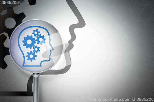 Image of Education concept:  Head With Gears with optical glass on digital background