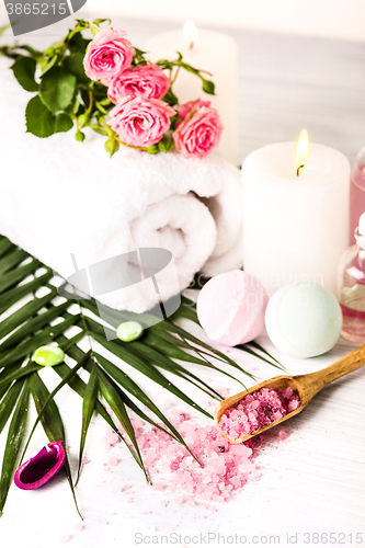 Image of Spa setting with pink roses and aroma oil, vintage style 